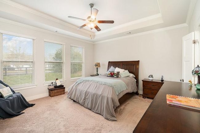 bedroom with light colored carpet, a raised ceiling, ceiling fan, and crown molding