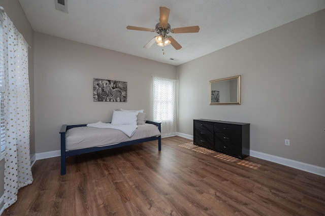 bedroom featuring dark hardwood / wood-style floors and ceiling fan