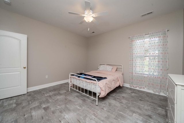 bedroom featuring hardwood / wood-style floors and ceiling fan