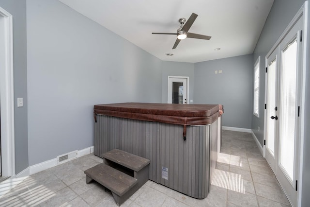 bar featuring ceiling fan and light tile patterned floors