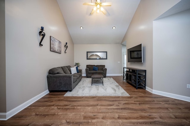 living room featuring ceiling fan, dark hardwood / wood-style flooring, and high vaulted ceiling