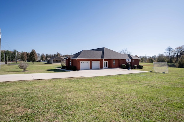 view of side of property with a garage and a lawn