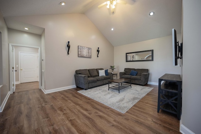 living room with ceiling fan, high vaulted ceiling, and dark hardwood / wood-style floors