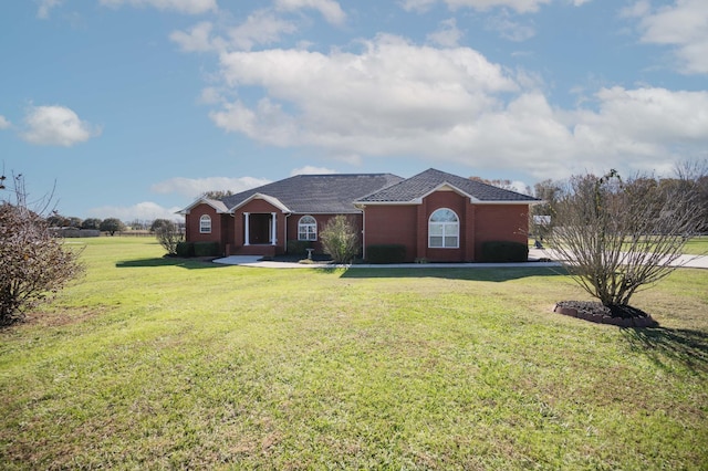 ranch-style house featuring a front lawn