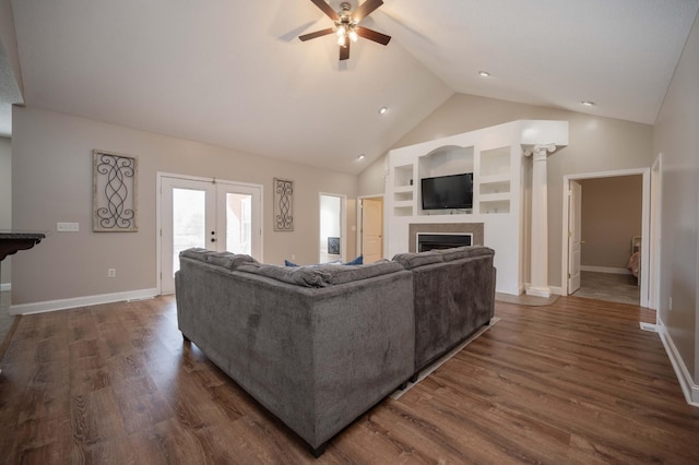 living room with french doors, ceiling fan, dark hardwood / wood-style flooring, and lofted ceiling