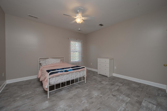 bedroom featuring hardwood / wood-style floors and ceiling fan