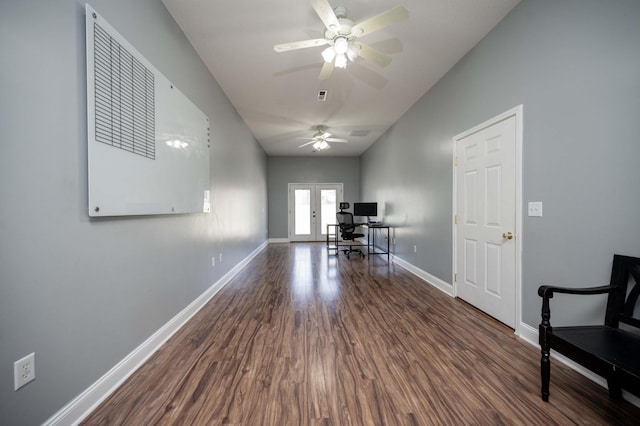 home office with ceiling fan, dark hardwood / wood-style flooring, and french doors