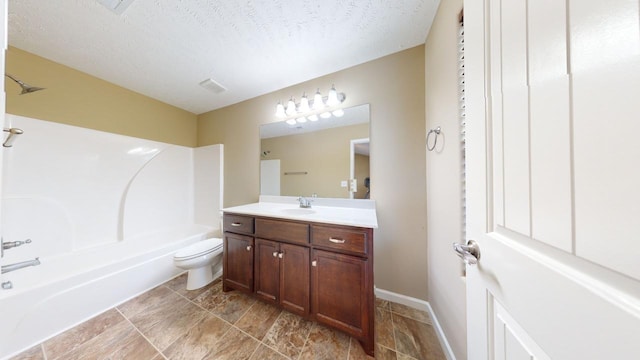 full bathroom featuring vanity, shower / bathtub combination, toilet, and a textured ceiling