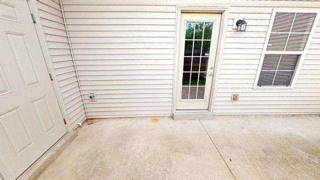 doorway to property featuring a patio area