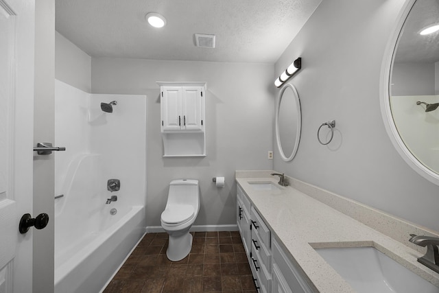 full bathroom featuring a textured ceiling, vanity, toilet, and tub / shower combination