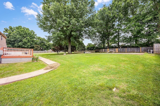 view of yard featuring a wooden deck