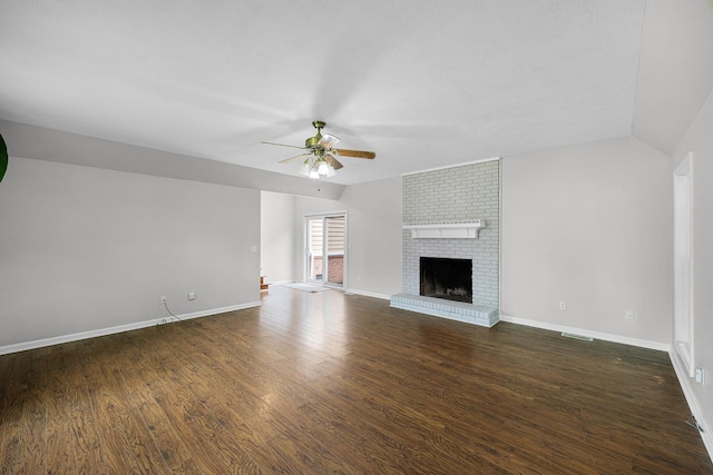 unfurnished living room with lofted ceiling, a fireplace, ceiling fan, and dark hardwood / wood-style floors