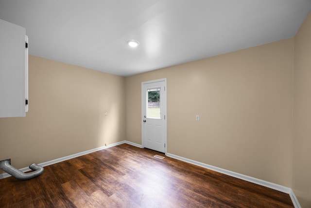 foyer with dark hardwood / wood-style floors