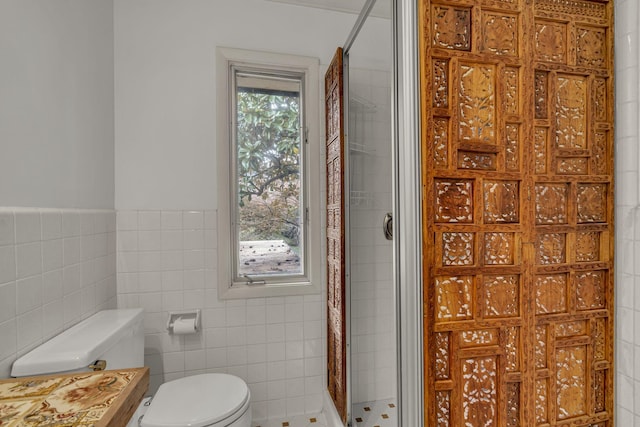 bathroom featuring walk in shower, a healthy amount of sunlight, tile walls, and toilet