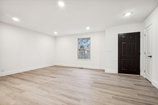 foyer entrance with light hardwood / wood-style flooring