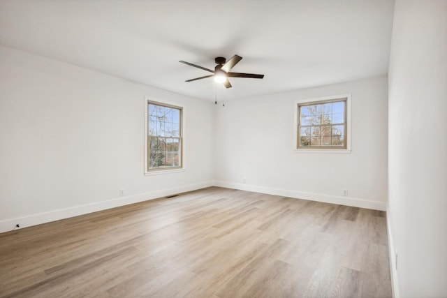 unfurnished room featuring ceiling fan and light hardwood / wood-style flooring