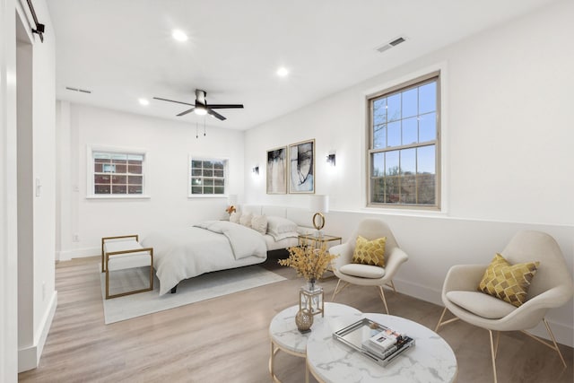 bedroom featuring ceiling fan and light hardwood / wood-style flooring