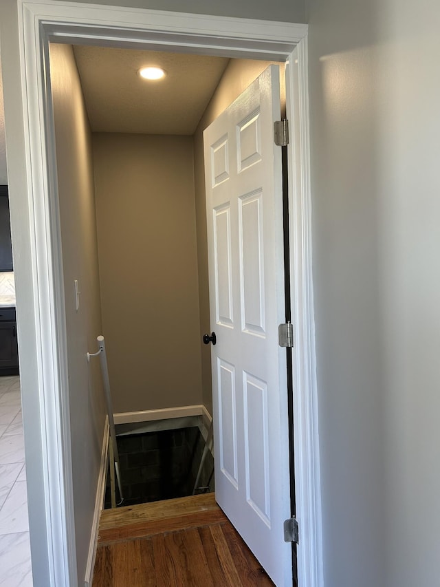 121 Poplar St N, Cowan, TN 37318 - stairway with wood finished floors and baseboards