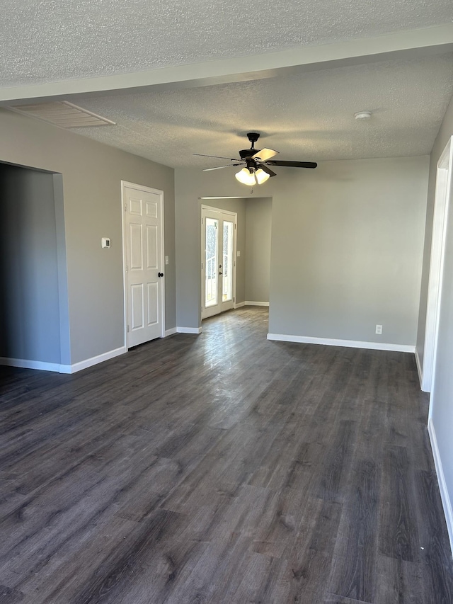 spare room featuring french doors, dark hardwood / wood-style flooring, a textured ceiling, and ceiling fan