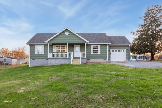 single story home featuring a garage, a front lawn, and covered porch