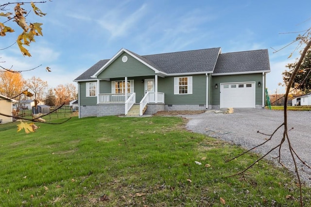 ranch-style home with a garage, a front yard, and a porch