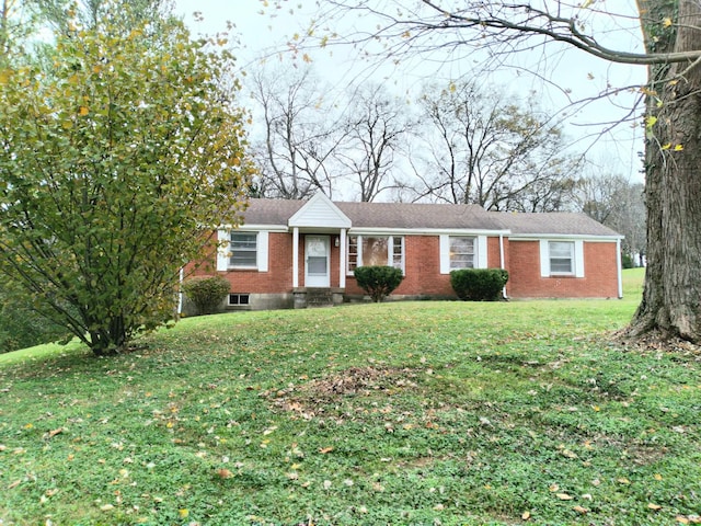 single story home with a front yard