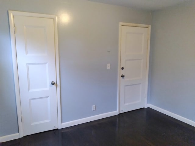 unfurnished room featuring dark hardwood / wood-style floors