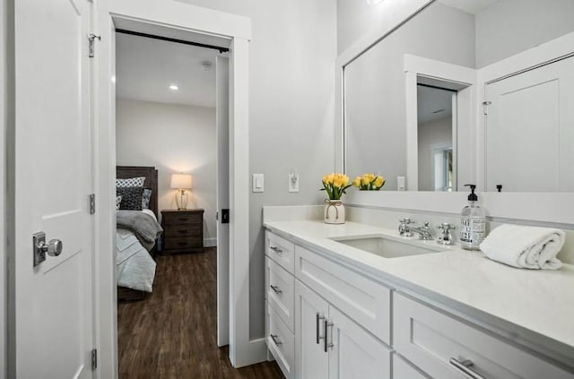 bathroom with vanity and hardwood / wood-style flooring