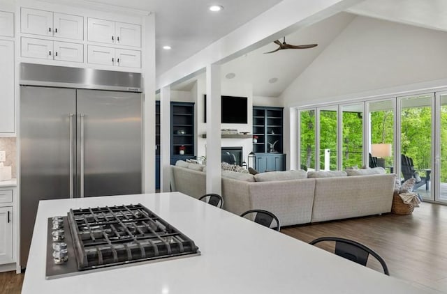 kitchen featuring appliances with stainless steel finishes, white cabinetry, and plenty of natural light