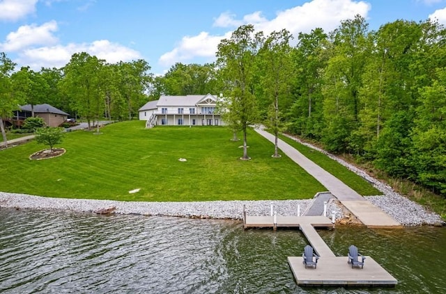 dock area featuring a water view and a lawn