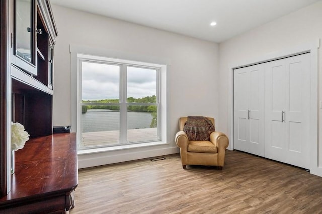 living area featuring hardwood / wood-style floors