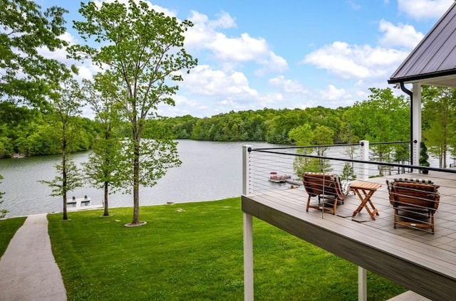 exterior space with a lawn and a water view