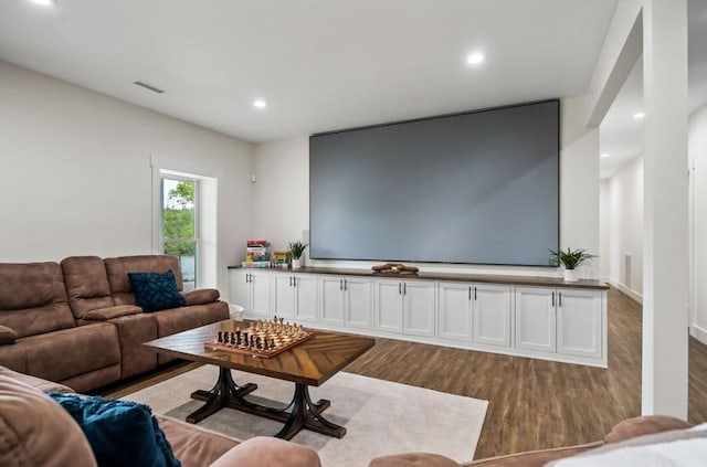 cinema featuring light hardwood / wood-style floors