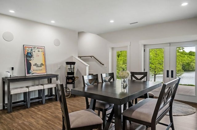 dining room featuring plenty of natural light and dark hardwood / wood-style floors