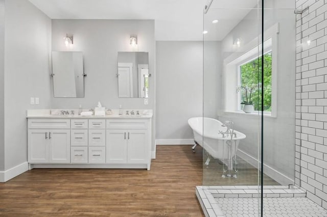 bathroom with vanity, wood-type flooring, and independent shower and bath