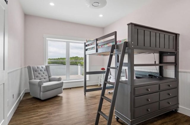 bedroom with dark hardwood / wood-style floors