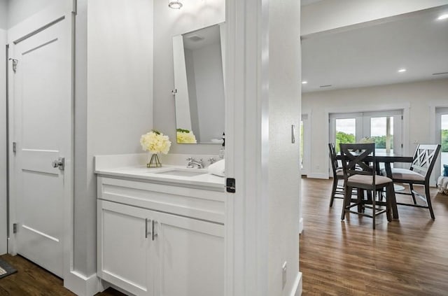 bathroom with vanity and hardwood / wood-style flooring