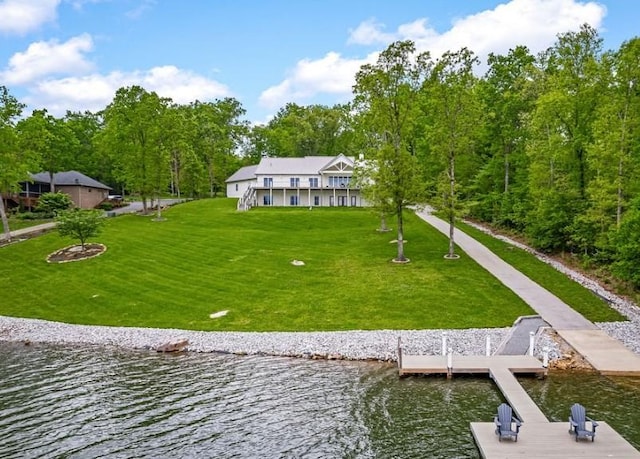 exterior space with a yard and a water view