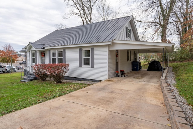 view of home's exterior featuring a yard and a carport