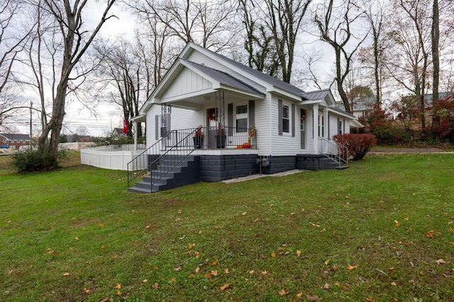 view of home's exterior featuring a yard and covered porch