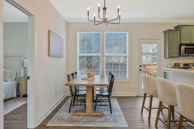 dining space with ornamental molding, an inviting chandelier, and dark wood-type flooring