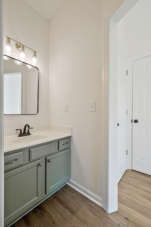 bathroom featuring hardwood / wood-style floors and vanity