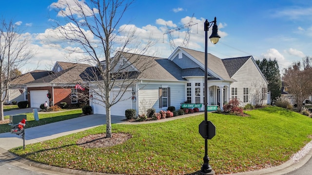 view of front of property featuring a front lawn and a garage