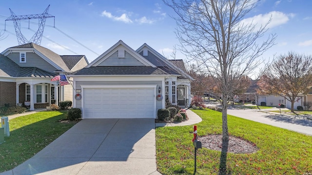 view of front of house featuring a front yard and a garage