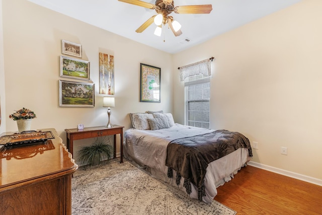 bedroom featuring hardwood / wood-style floors and ceiling fan