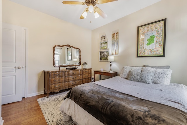 bedroom with ceiling fan and light wood-type flooring