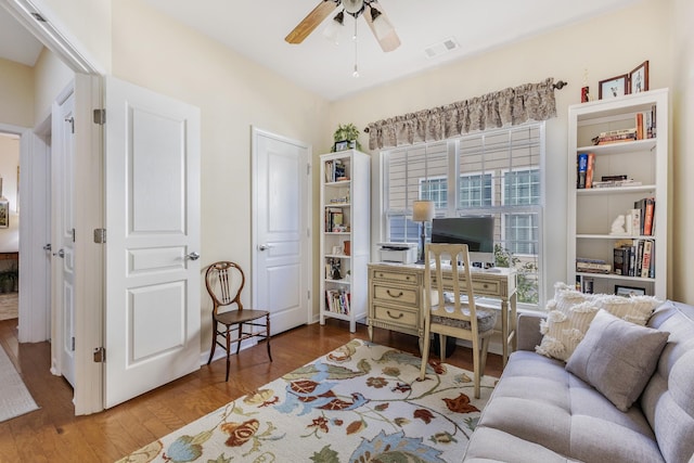 interior space with ceiling fan and hardwood / wood-style floors