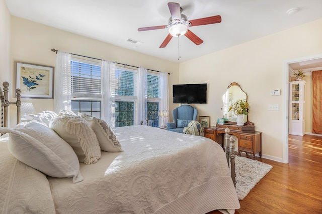 bedroom with light wood-type flooring and ceiling fan