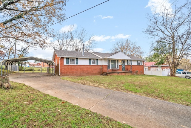 view of front of property with a carport and a front yard