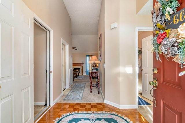 foyer featuring a textured ceiling and light parquet floors